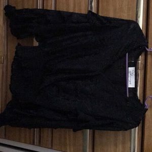 Black top with ruffle sleeves